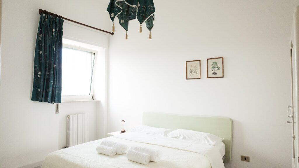 Bright and cozy private room at Masseria Olga, a rural coliving in Italy with comfortable accommodations