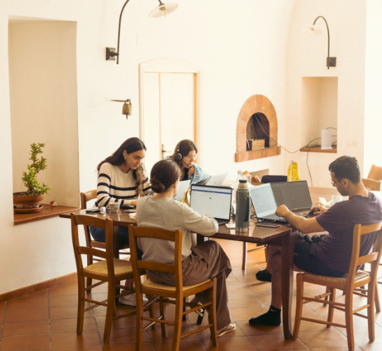 Coworking session with digital nomads in a coliving space in Italy at Masseria Olga