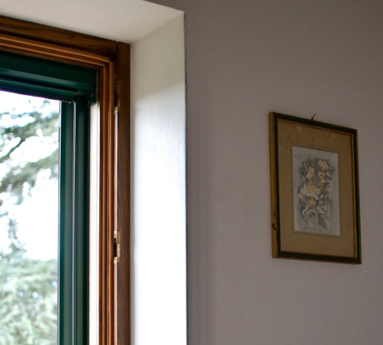 Window and Wall Decor in Single Room at Masseria Olga Coliving in Italy